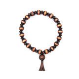 BR190325-14     Copper Navajo bead bracelet with squash blossom charm