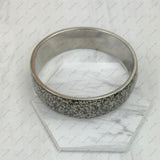 BR231209-01                                  silver metal with black shell bangle