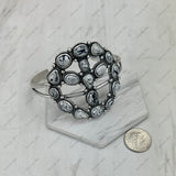 BR250930-01-WHITE BUFFALO                  Silver metal with white buffalo turquoise stone peace sign Bangle