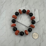 BR251230-63                Red roundel with black beads stretch Bracelet