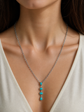 NKY231115-05-BLUE                 22 inches silver metal chain with four blue turquoise stone teardrops Necklace