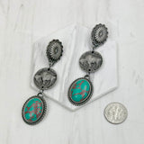 ERZ231205-21                   Silver metal flower and buffalo concho with blue turquoise oval stone Earrings