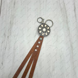 NKY250121-59                  Silver metal and white stone with brown leather Key chain
