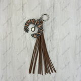 PC260406-23                  Western Leather feather with brown tassel Purse charm