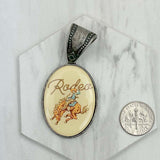 PD231210SL-71                                silver metal oval cowboy pendent