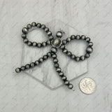 PD250306-02          Silver Navajo pearl beads Bow tie Pendant