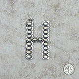 PDS230703H-ORANGE  	Silver with orange stone letter H pendant