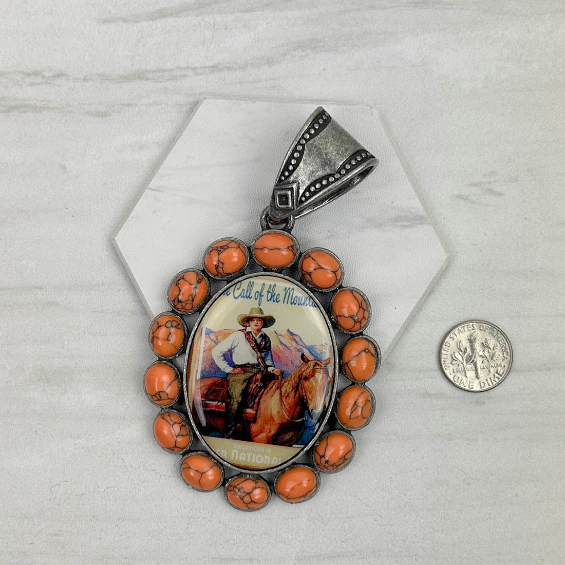PDS230827-07             Silver oval with orange stone cowgirl pendent
