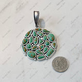 PDS250330-01-BLUE              50mm Round Silver metal with Blue TQ stone Pendent