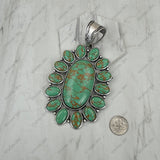 PDS251230-01SL-BLUE                 Silver metal with blue turquoise stone oval flower concho Pendent