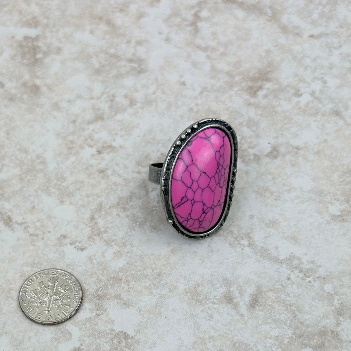 RGS230701-01-PINK	Silver with hot pink stone oval adjustable Ring